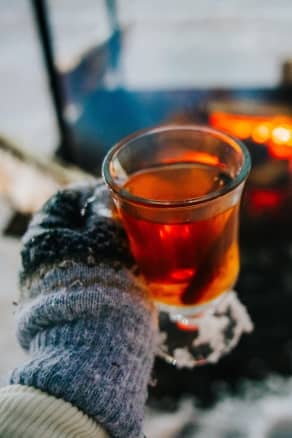 Warm hot cider by a bonfire at The Highlands